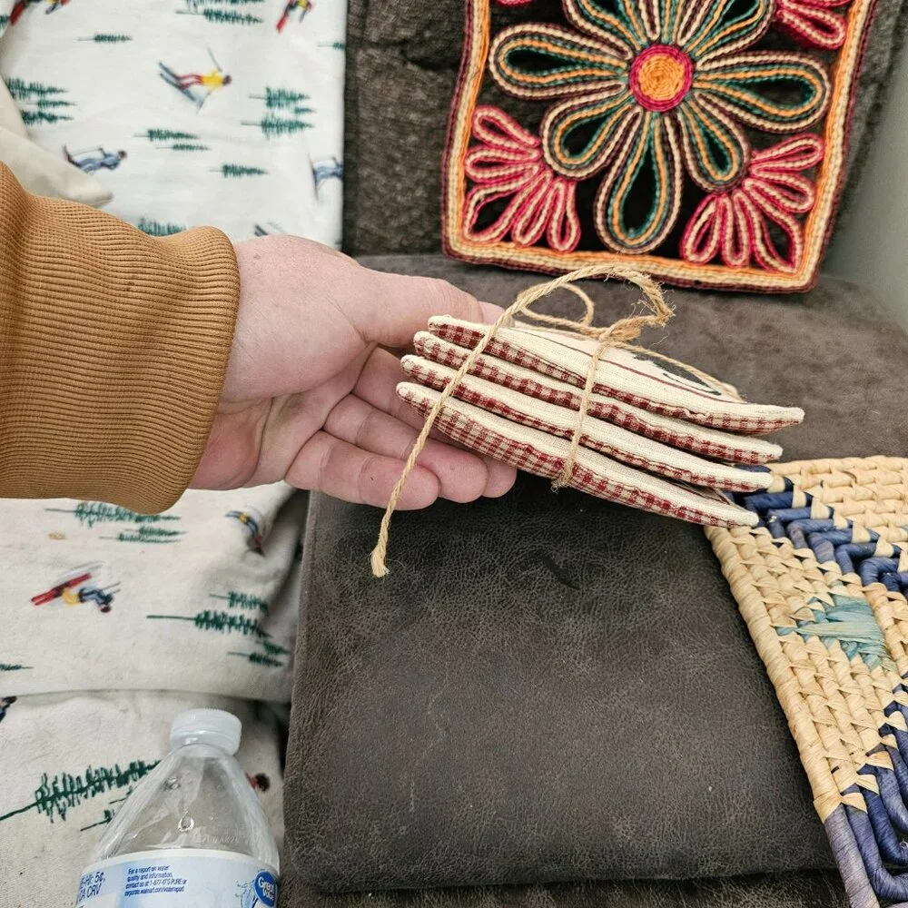 Assorted handmade plant mats and cat coasters